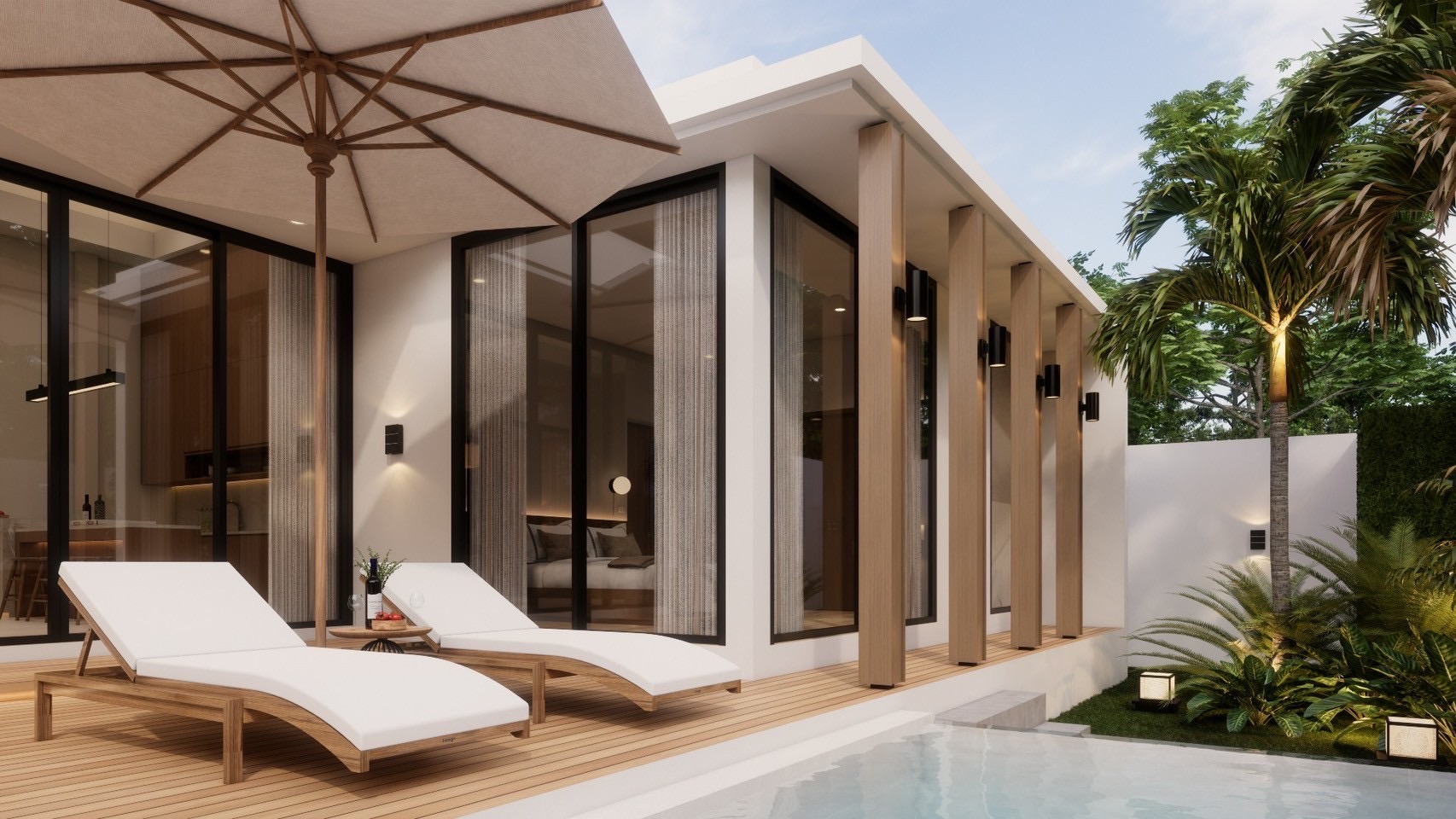 A large pool villa surrounded by tall trees